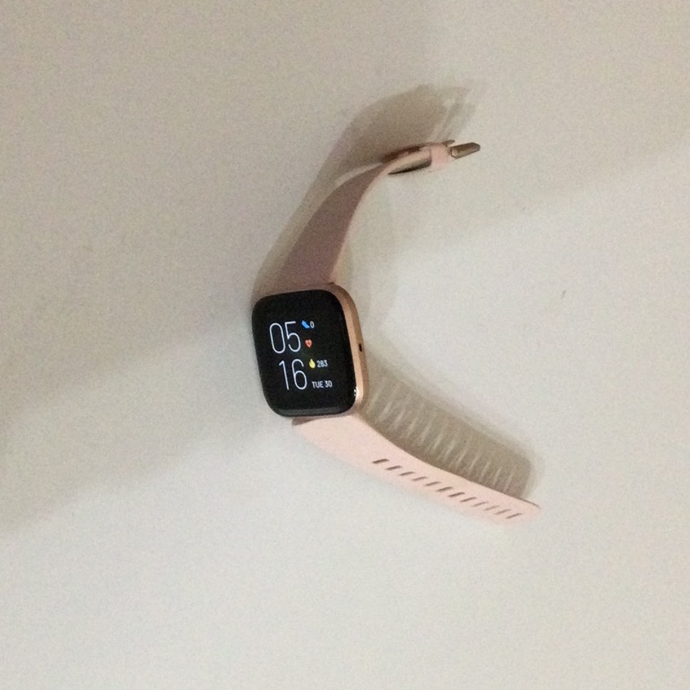 Fitbit watch. Slightly new. Worn a few months. Minimal damage to strap.